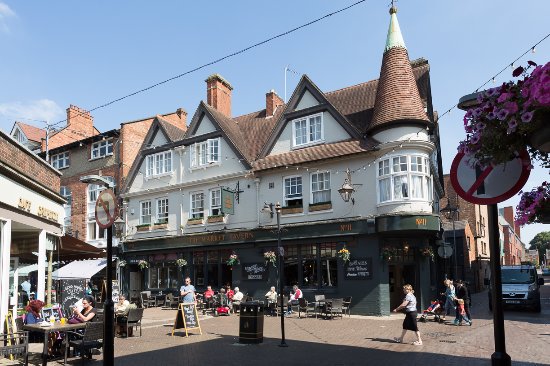 Northampton town centre with historic buildings and high street shops
